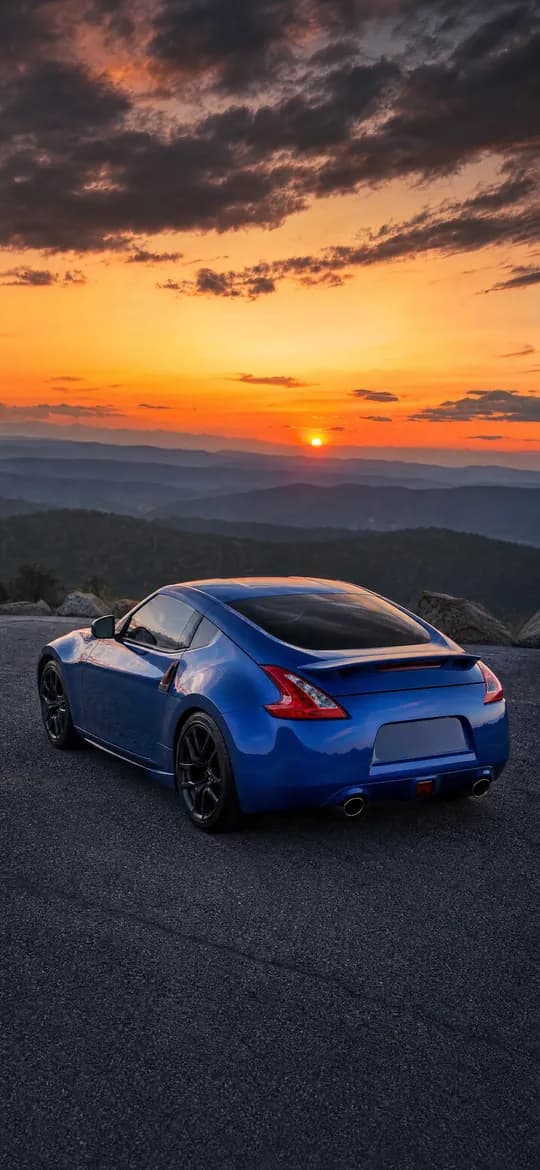 Blue Nissan 370Z at sunset, phone wallpaper