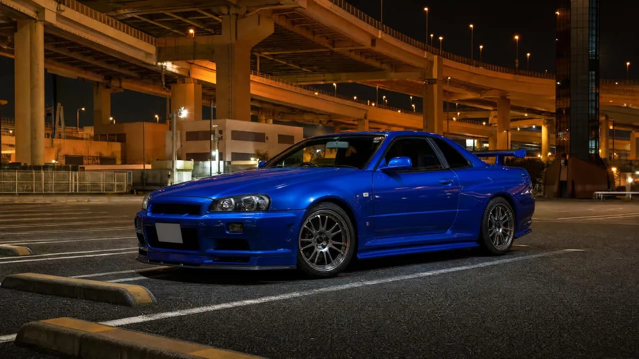 Bayside Blue R34 Skyline GT-R at Daikoku parking area at night