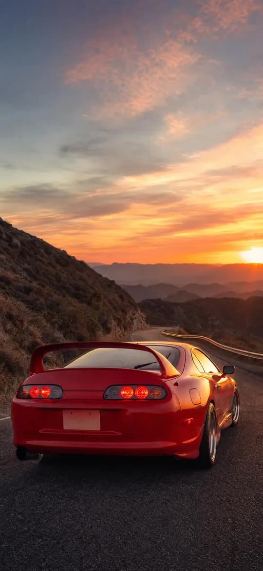 Red Toyota Supra MK4 rear view at sunset, phone wallpaper